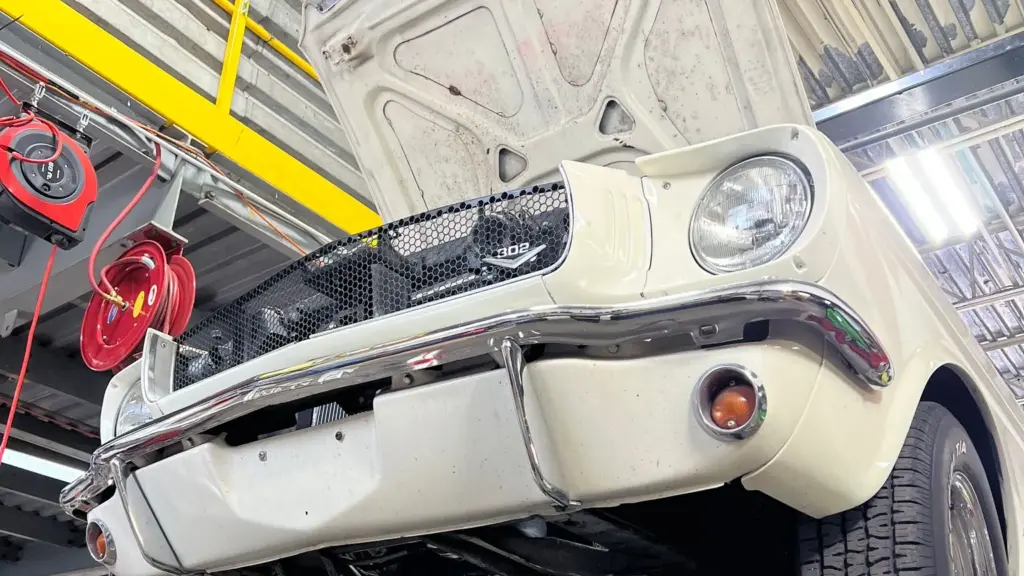 Car on the lift for suspension work at Midas Rivière-des-Prairies